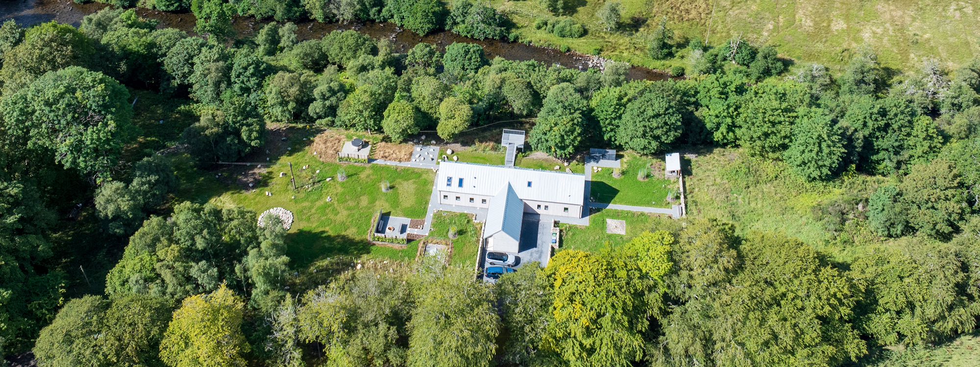 larch house glenshee luxury self catering eco lodge and river viewed from above