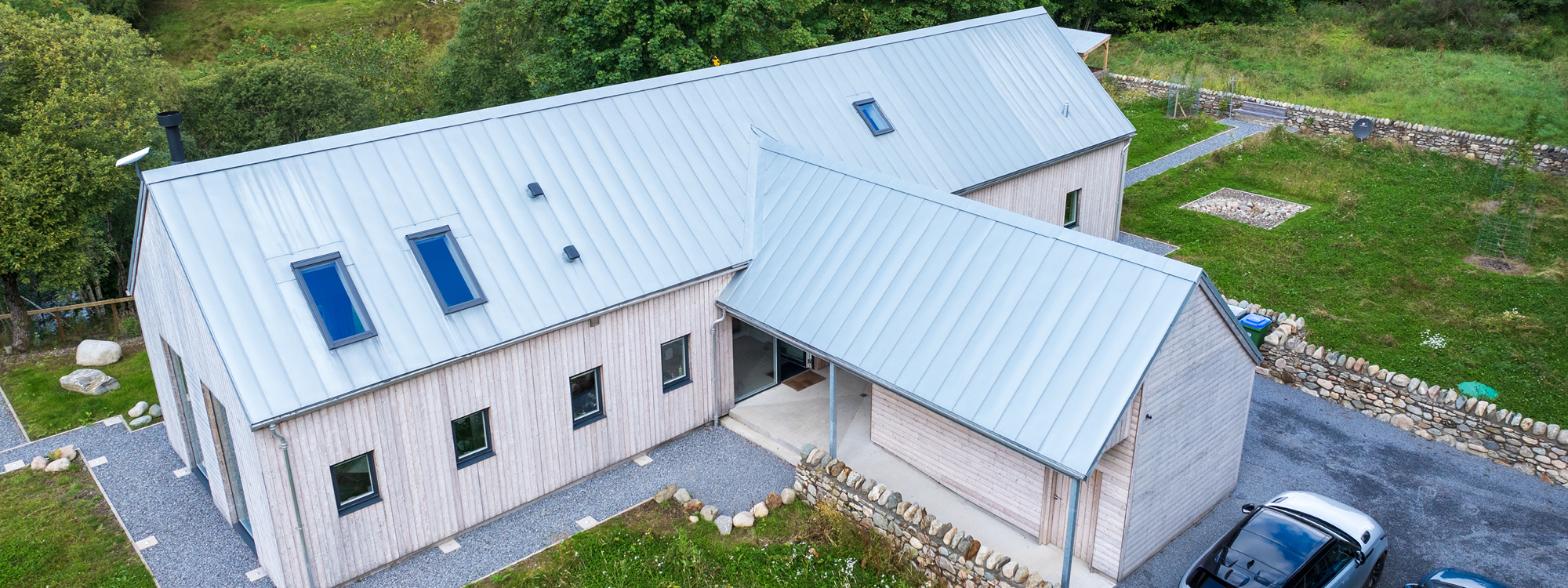 Architect designed Larch House Glenshee has timber cladding and a standing seam roof, and can be rented for holidays in the Cairngorms, Scotland